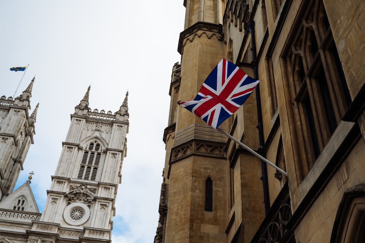 Union Jack flag on historic UK government building, representing the official process of apostille certification in the United Kingdom.