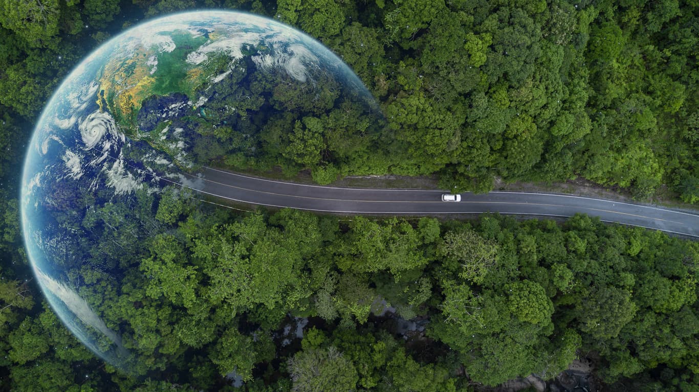 A car driving through a forest with a superimposed Earth – symbolizing international travel freedom. Learn everything about International Driving Licenses and how to get yours verified with NotaryPublic24.